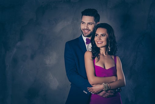 Married Couple Posing for a Photo Wearing Nave Blue Clothes