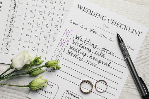 Wedding Checklist and Calendar on White Wooden Table